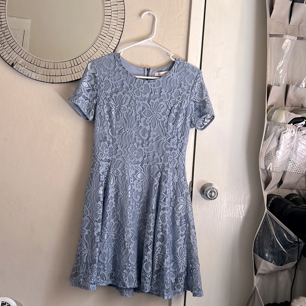 Francesca’s shiny lace dress
